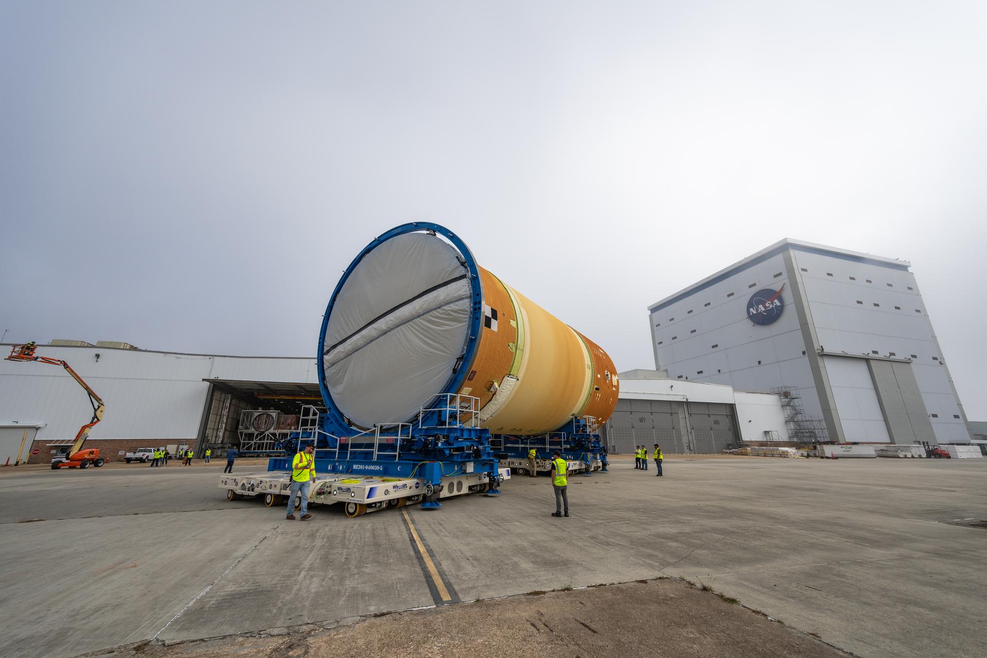 Move crews at NASA’s Michoud Assembly Facility in New Orleans, lift the forward-joined flight hardware for the agency’s SLS (Space Launch System) rocket out of a stacking cell in the vertical assembly building on Dec. 19, 2025. The forward join, which consists of the intertank, liquid oxygen tank, and forward skirt, will be used on the core stage slated for NASA’s Artemis III mission. Teams moved the flight hardware from the cell and set it atop self-propelled mobile transporters. The article was brought to the factory’s final assembly area on Dec. 27, 2025 where it will be mated to the core stage’s previously joined liquid hydrogen tank and undergo further integration.    The core stage, along with its four RS-25 engines, produce more than two million pounds of thrust to help launch NASA’s Orion spacecraft, astronauts, and supplies beyond Earth’s orbit and to the lunar surface for Artemis.